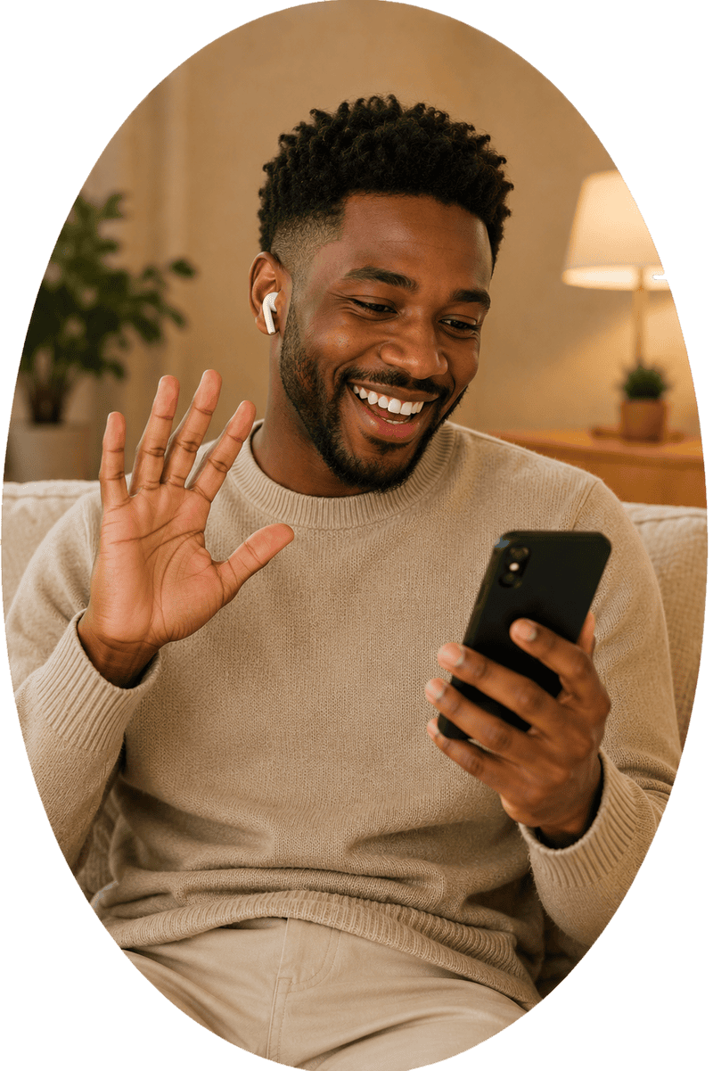 A young man wearing wireless earbuds waves happily while participating in an instant 1v1 video chat on his mobile phone